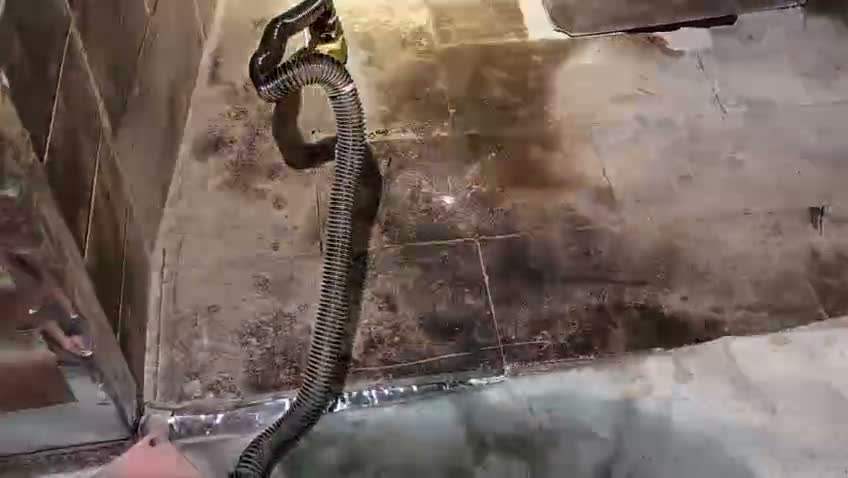 Professional vacuum equipment controlling soot during chimney cleaning